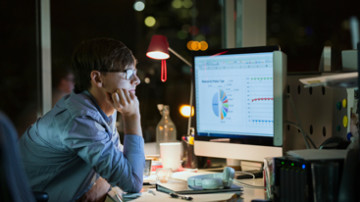 A man looking through data for nonprofits