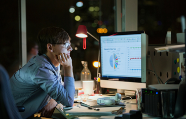 A man looking through data for nonprofits