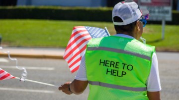 Volunteer assisting with parking