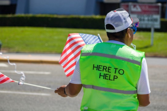 Volunteer assisting with parking