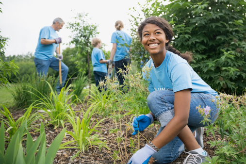 Smiling volunteer working in garden