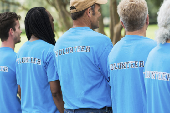 Group of men volunteering in a park