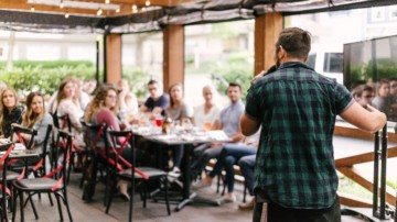 A man speaking to a group of people