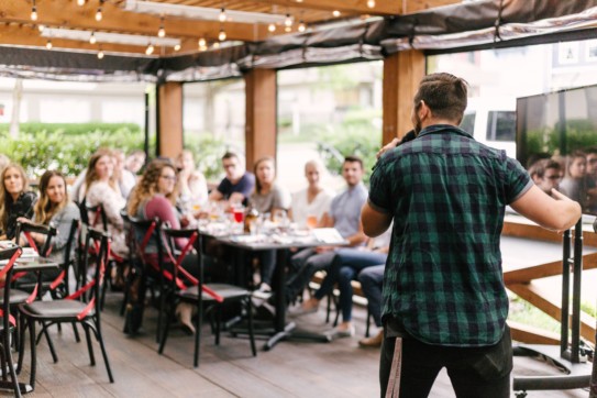 A man speaking to a group of people