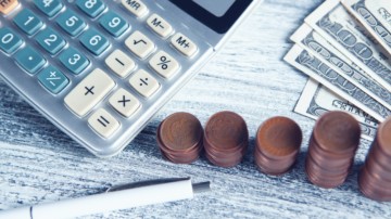 calculator and money on a table