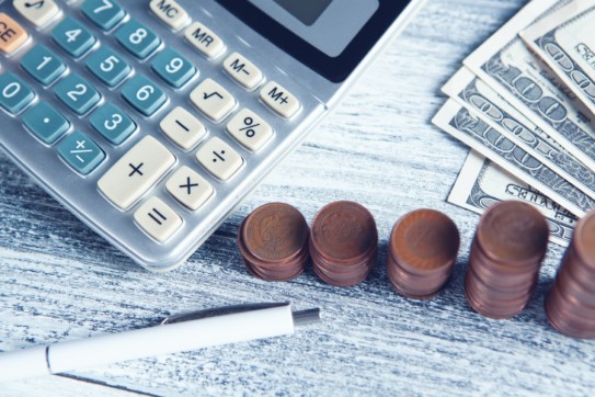 calculator and money on a table