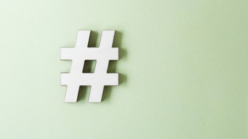 a hashtag on a simple, light green background